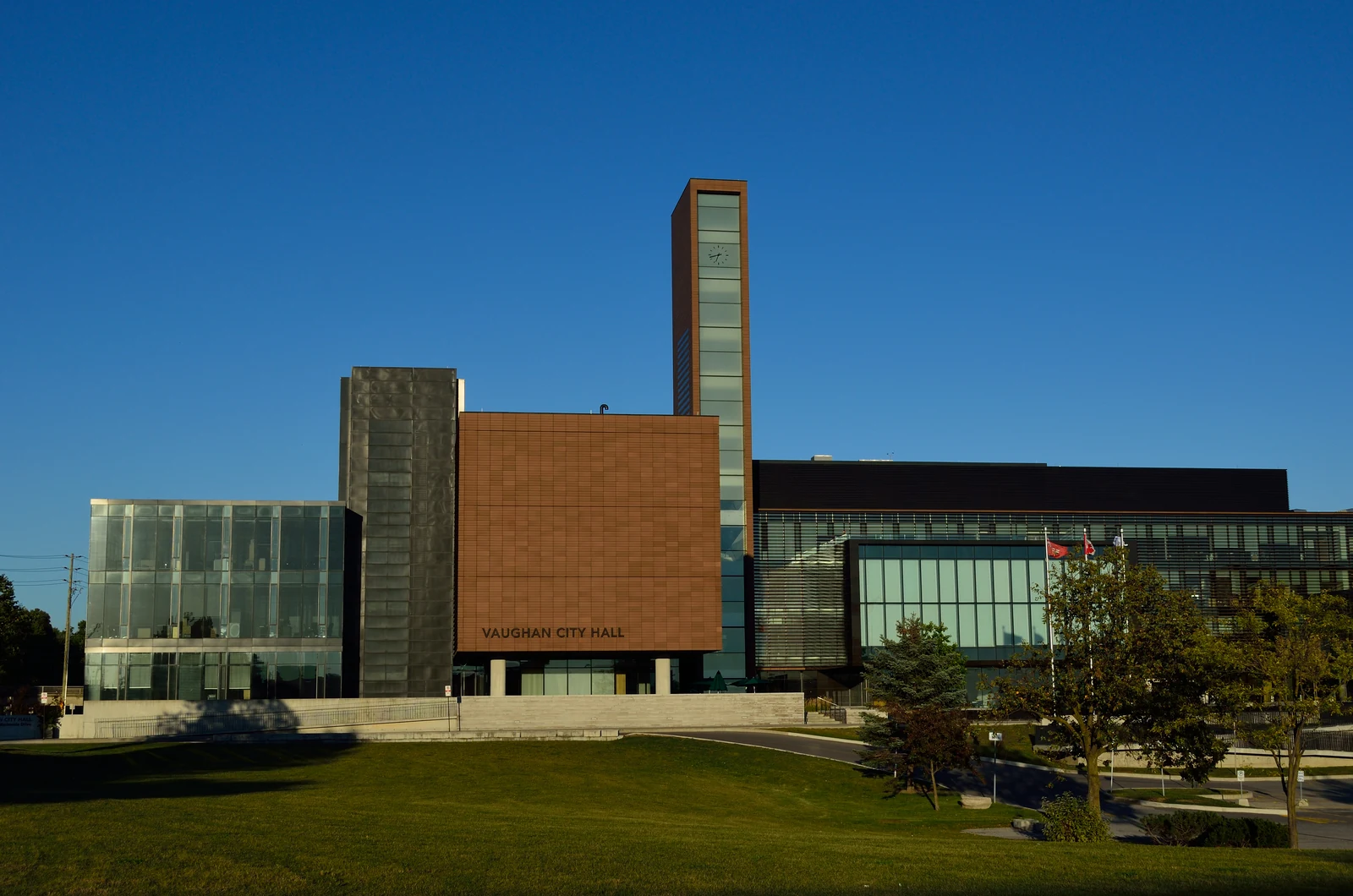 Vaughan City Hall, a modern civic building with a glass curtain wall and terracotta-clad tower, in Vaughan, Ontario